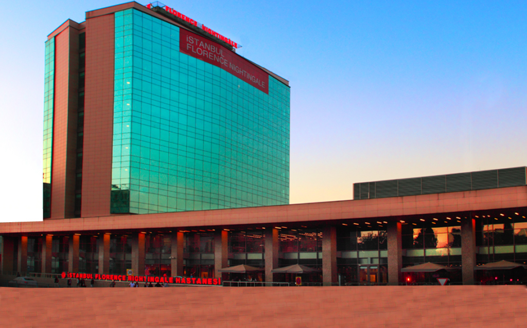 The image captures the iconic Florence Nightingale Hospital, renowned for its excellence in cardiology, oncology, and neurosurgery, with state-of-the-art diagnostic equipment