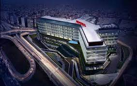 The image presents Memorial Hospital’s sophisticated environment, focusing on its innovative robotic surgery capabilities and specialized care in oncology and organ transplants.